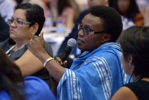 A 2014 GPF participant asks a question during a the Financial literacy: Empowering consumers, improving lives session.